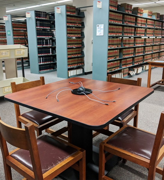 Charging table, 4 chairs, near books